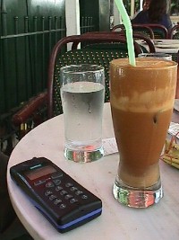 Frappe and Cell Phone: add a pack of cigarettes and a lighter and you have the Athens Survival Kit