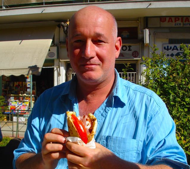 Matt Barrett eating souvlaki in Athens